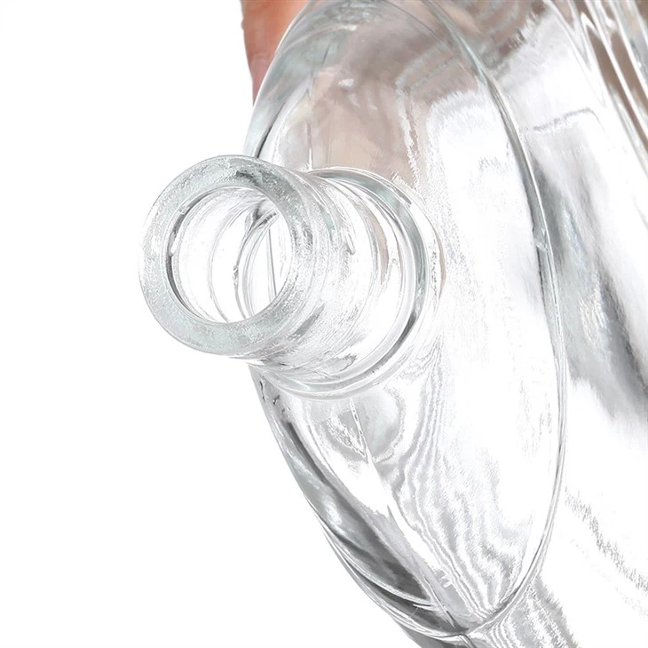 Transparent Bottle With Wavy Pattern And Silver Crown Cap